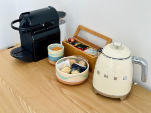 a toaster sitting on top of a counter next to a box at Salty Suite in Levanto