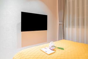 Μια τηλεόραση ή/και κέντρο ψυχαγωγίας στο Hangzhou Leyin Homestay