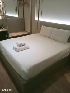 Postel nebo postele na pokoji v ubytování Sunland Hotel