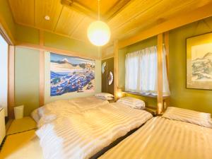 Ένα ή περισσότερα κρεβάτια σε δωμάτιο στο 優中富良野