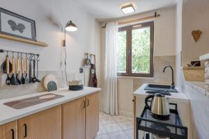 Kuchyň nebo kuchyňský kout v ubytování Guest House Jolanda