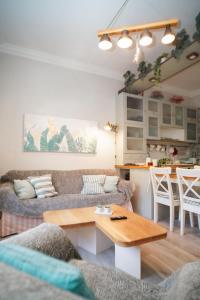 a living room with a couch and a table at Contessina Apt. in Corfu Town