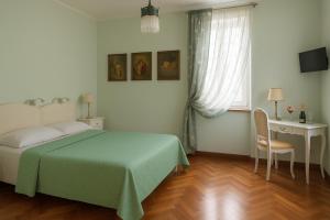 Postel nebo postele na pokoji v ubytování Miglioranzi Rooms