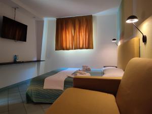 Postel nebo postele na pokoji v ubytování Hotel Alisei