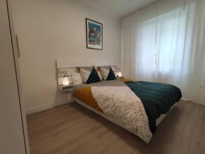 Ένα ή περισσότερα κρεβάτια σε δωμάτιο στο Apartamento Larraina