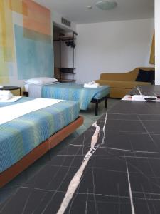Postel nebo postele na pokoji v ubytování Hotel Alisei