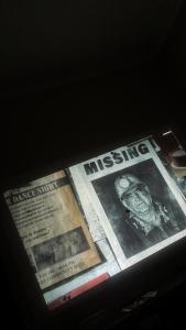 a news paper with the headline missingbestosbestosbestos at Wilson Homes in Masaka