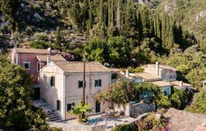 an aerial view of a house in a mountain at Aga's Seaview Cottages in Ágios Márkos