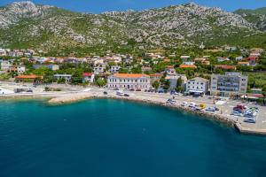 an aerial view of a town next to the water at Apartments Mirela in Karlobag