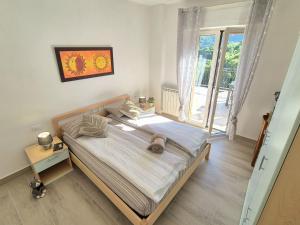 Posteľ alebo postele v izbe v ubytovaní Residence Casa Silvana