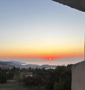 a sunset from the top of a building at Philoxenia in Kavála