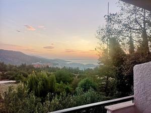 a view of the ocean from the balcony of a house at Philoxenia in Kavála