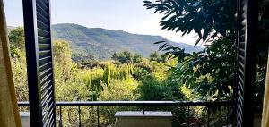 a balcony with a view of a mountain at Philoxenia in Kavála