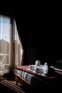 Posteľ alebo postele v izbe v ubytovaní Hotel Akropol