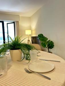 a table with a plate on top of it at Airtegal Dunas de Cedeira in Cedeira