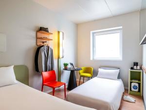 Ein Bett oder Betten in einem Zimmer der Unterkunft Ibis Budget Bilbao Barakaldo
