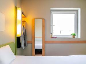 Ein Bett oder Betten in einem Zimmer der Unterkunft Ibis Budget Bilbao Barakaldo