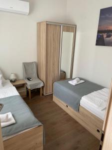 A bed or beds in a room at Csillag Virág Vendégház
