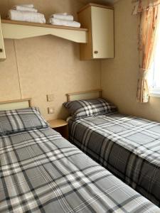 Postel nebo postele na pokoji v ubytování Curacao Caravans