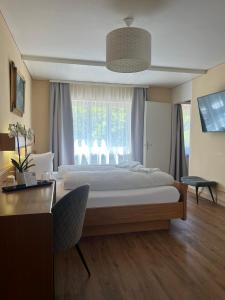 Voodi või voodid majutusasutuse Hotel Falknerei Galina toas