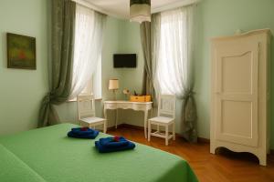 Postel nebo postele na pokoji v ubytování Miglioranzi Rooms