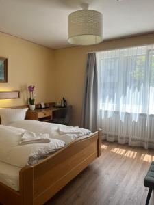 Voodi või voodid majutusasutuse Hotel Falknerei Galina toas