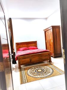 Postel nebo postele na pokoji v ubytování Denisa homestay Kuningan 2 + 1 fotografie