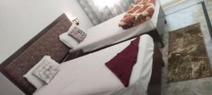 Postel nebo postele na pokoji v ubytování Karma Hostel