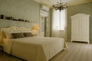 Postel nebo postele na pokoji v ubytování Miglioranzi Rooms