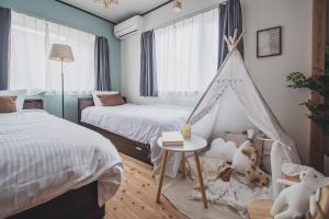 Postel nebo postele na pokoji v ubytování AKIYATO DATE DREAM DATE home