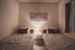 Postel nebo postele na pokoji v ubytování AKIYATO DATE DREAM DATE home