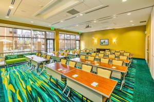 a classroom with tables and chairs in a room with yellow walls at Springhill Suites by Marriott Anaheim Maingate in Anaheim +48 photos