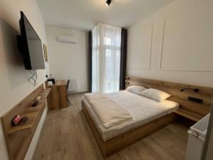 Postel nebo postele na pokoji v ubytování FOX Hostel