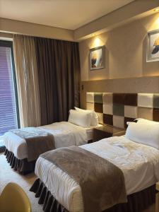 Postel nebo postele na pokoji v ubytování DreamLand oasis Chakvi