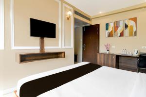 TV a/nebo společenská místnost v ubytování Townhouse OAK Nilay Residency