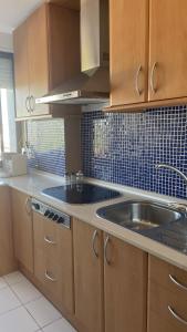 a kitchen with a sink and a counter top at Maravilloso apartamento Delux in Blanes