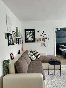 a living room with a couch in a room at Your Place in Tallinn - newly renovated! in Tallinn