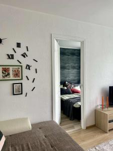 a bedroom with a bed and a door leading to a room with a bed sidx at Your Place in Tallinn - newly renovated! in Tallinn