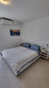 a bedroom with a large bed in a room at Center of Rovinj, sea view apartment in Rovinj