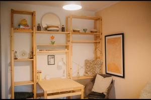 a living room with wooden shelves and a table at Gemütliche zentrumsnahe Wohnung, eigene Terrasse in Cologne +10 photos