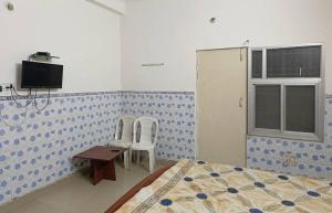 TV a/nebo společenská místnost v ubytování Hotel Satya Narayan