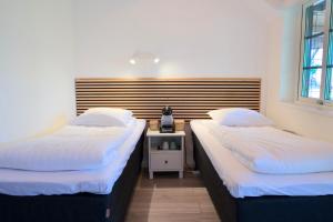 Postel nebo postele na pokoji v ubytování GEG Hotel