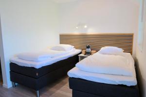 Postel nebo postele na pokoji v ubytování GEG Hotel