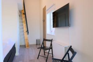TV a/nebo společenská místnost v ubytování GEG Hotel