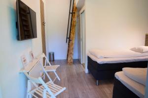 Postel nebo postele na pokoji v ubytování GEG Hotel