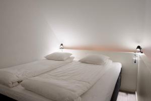 Postel nebo postele na pokoji v ubytování GEG Hotel