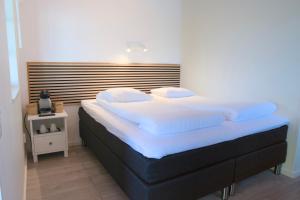 Postel nebo postele na pokoji v ubytování GEG Hotel