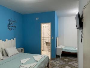 Postel nebo postele na pokoji v ubytování Pousada Recanto do Norte
