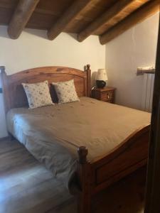 Katil atau katil-katil dalam bilik di Chalet al BORGO ANTICO