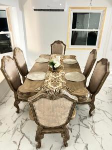 a dining room with a wooden table and chairs at CampRV Main Lodge in Elkins